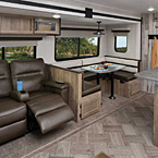 32 MBDS This convertible 84” U-dinette provides a large sleeping area with storage access doors below. Optional theater seats with drink holder shown.